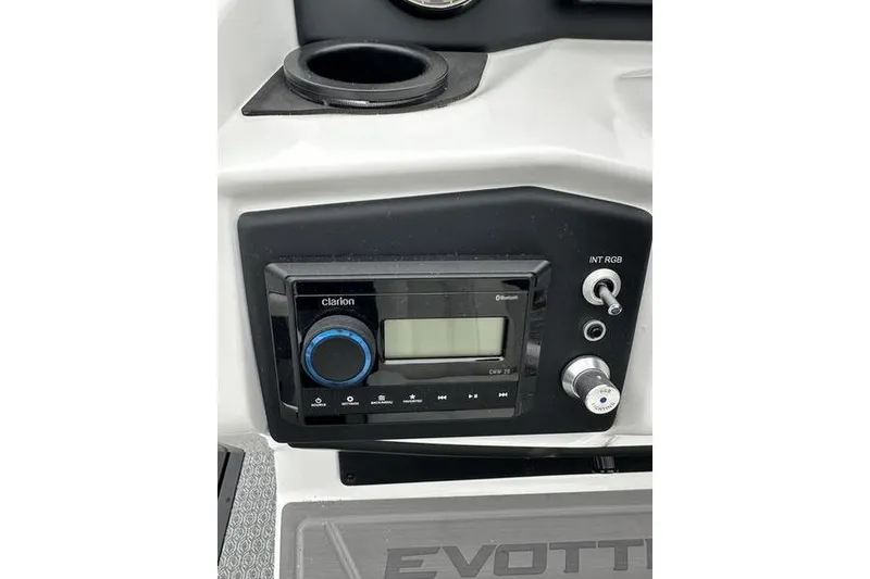Slide: The Image of Control panel of 2026 EVOTTTI 523CS with Clarion audio system and cup holder. - 23