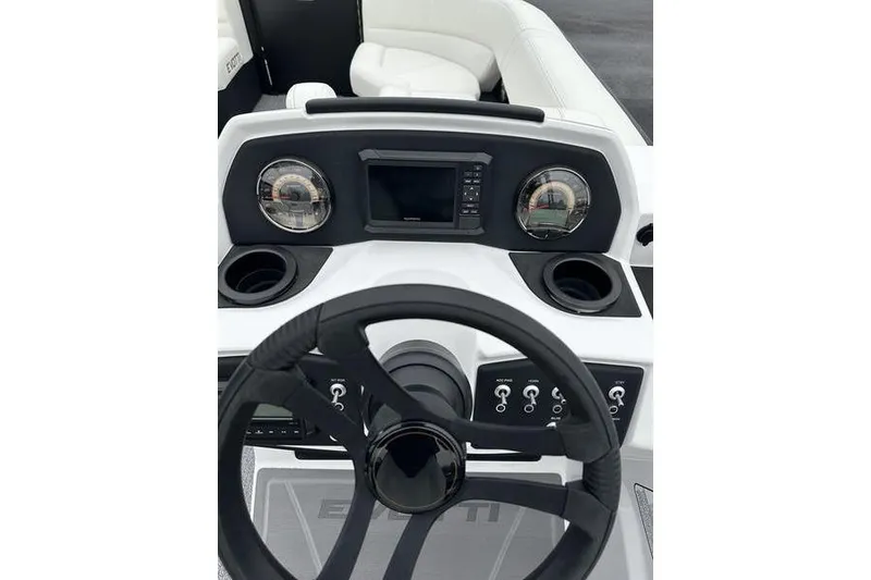 Slide: The Image of Steering console of 2026 EVOTTTI 523CS boat with modern controls and display. - 26