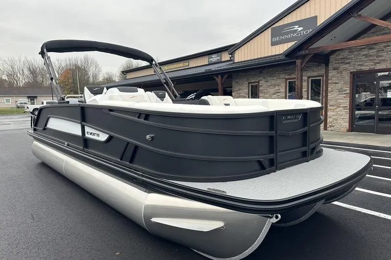 Slide: The Image of 2026 EVOTTTI 523CS pontoon boat parked outside dealership. - 4