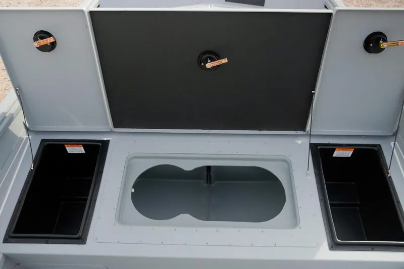 Slide: The Image of 2026 G3 Bay 17 boat storage compartments with open lids, showcasing interior design. - 11