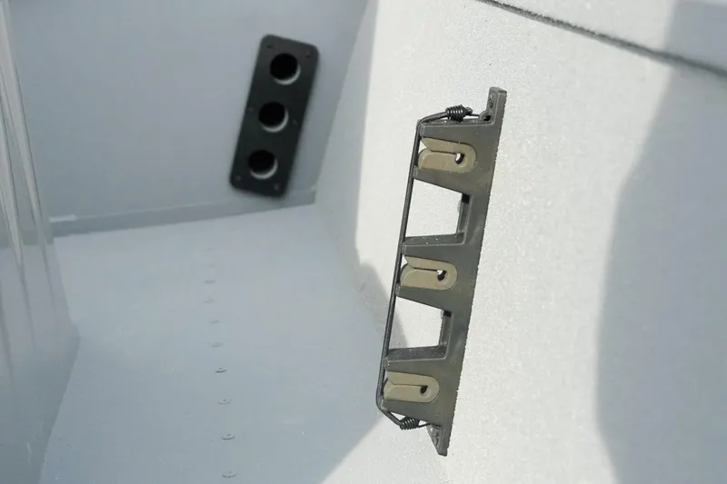 Slide: The Image of Interior view of 2026 G3 Bay 17 boat, featuring rod holders and storage brackets. - 14