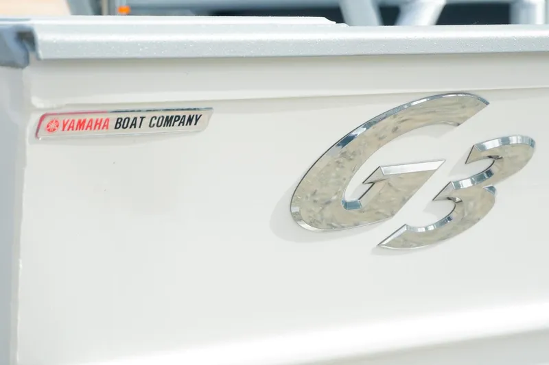 Slide: The Image of 2026 G3 Bay 17 boat by Yamaha Boat Company, featuring sleek metallic logo. - 18
