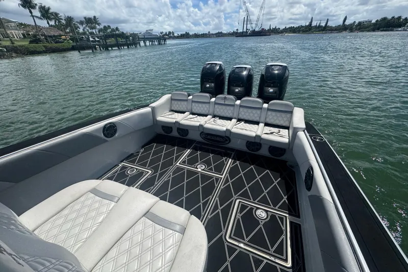 Slide: The Image of 2016 Statement 380 Open boat with luxurious seating and powerful engines on a scenic waterway. - 11