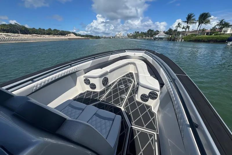 Slide: The Image of Luxurious 2016 Statement 380 Open boat interior with stylish seating and scenic waterway view. - 13
