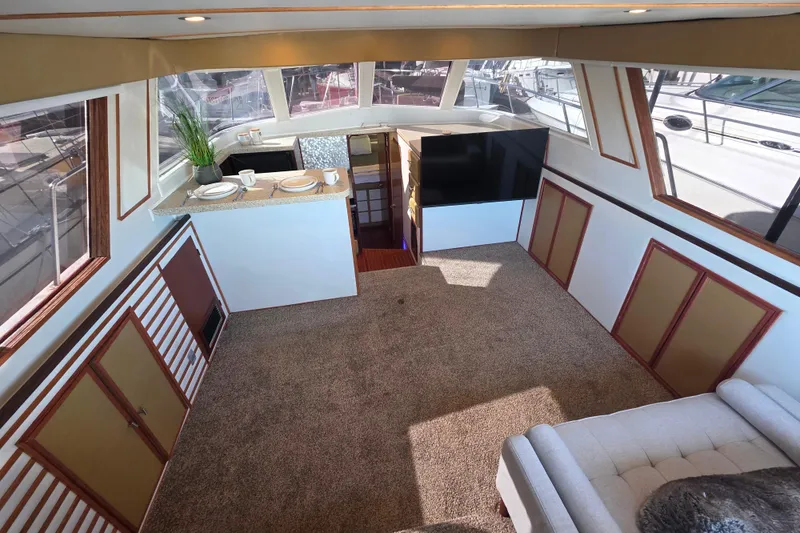 Slide: The Image of Luxurious interior of 1990 Novatec 44 Aft Cockpit Motor Yacht with modern decor. - 14