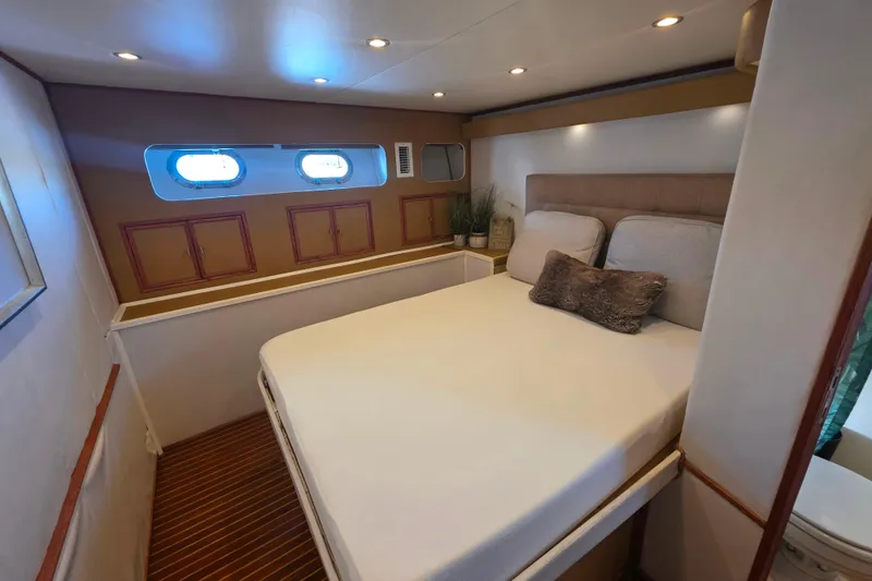 Slide: The Image of Cozy bedroom in 1990 Novatec 44 Aft Cockpit Motor Yacht with porthole windows. - 28