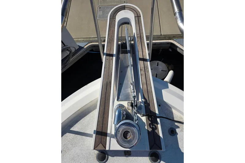 Slide: The Image of Anchor system on 1990 Novatec 44 Aft Cockpit Motor Yacht, featuring stainless steel and wood accents. - 54