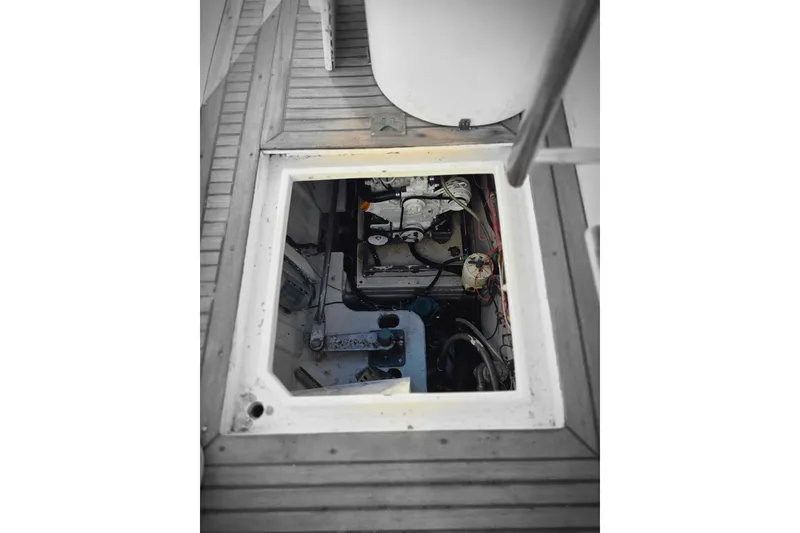 Slide: The Image of Engine compartment of 1990 Novatec 44 Aft Cockpit Motor Yacht, showing mechanical components. - 59