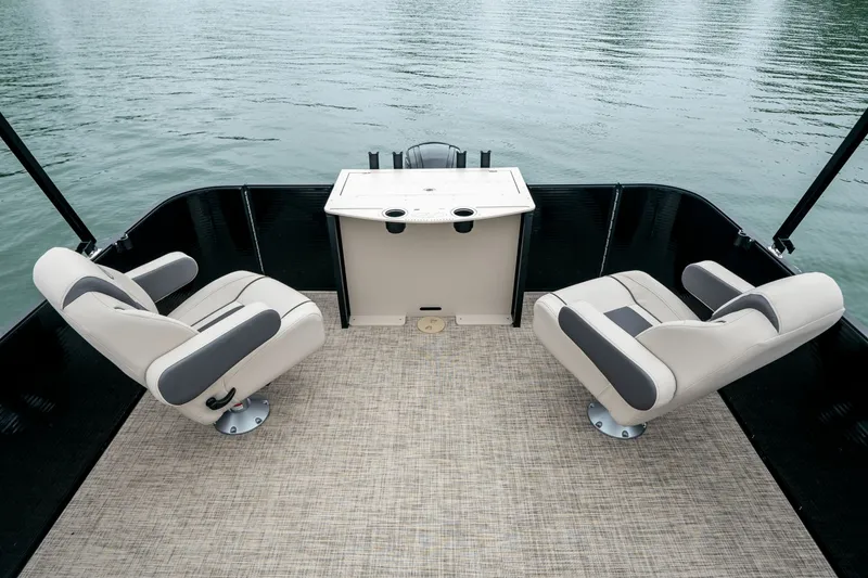 Slide: The Image of Interior of 2026 Harris Cruiser 210 pontoon boat on calm water. - 5