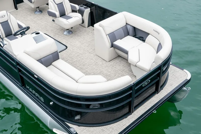 Slide: The Image of Harris Cruiser 210 pontoon boat 2026 on water with luxurious seating area. - 8