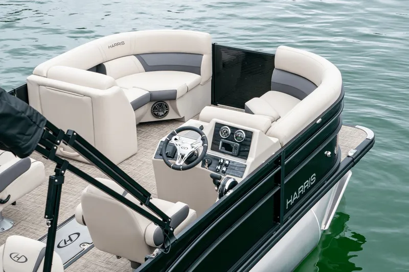Slide: The Image of Harris Cruiser 210 boat, luxurious interior, on water, model year 2026. - 9