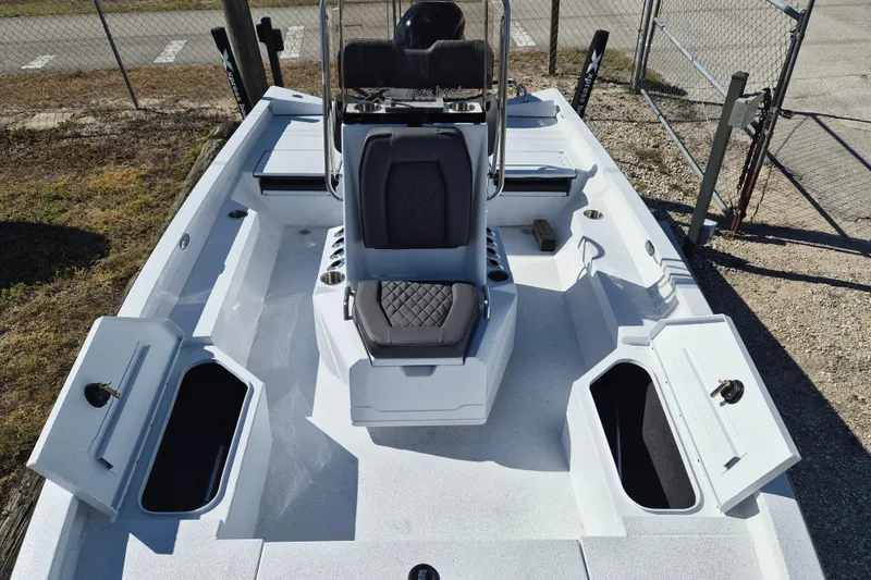 Slide: The Image of 2026 Xpress H20B Bay boat interior with open storage compartments and seating. - 8