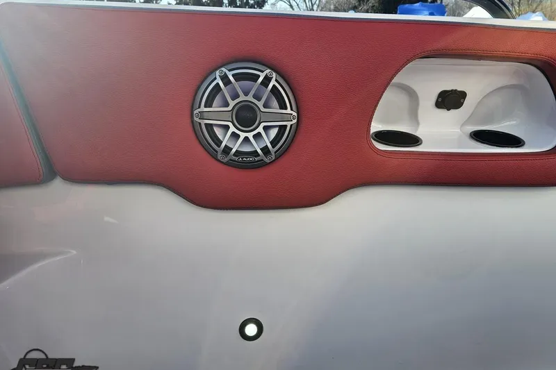 Slide: The Image of Red and white interior of 2025 Concept 27' CC boat with speaker detail. - 100