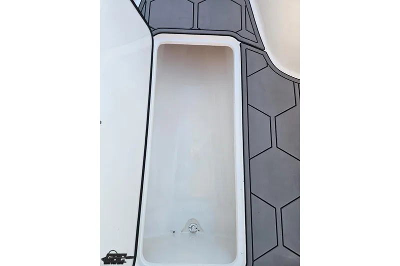 Slide: The Image of 2025 Concept 27' CC boat storage compartment with hexagonal patterned flooring. - 102