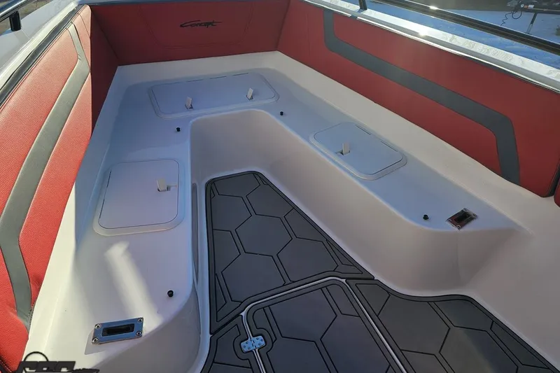 Slide: The Image of Interior of 2025 Concept 27' CC boat with red and gray seating and storage compartments. - 103