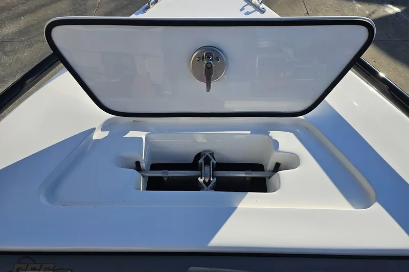 Slide: The Image of Open hatch on 2025 Concept 27' CC boat, revealing storage compartment. - 104