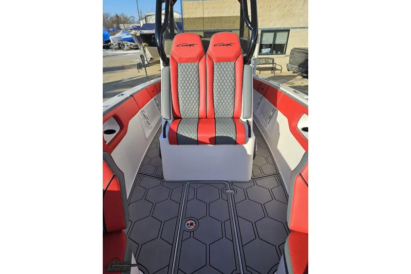 Slide: The Image of 2025 Concept 27' CC boat interior with red and gray seating, hexagonal flooring. - 105