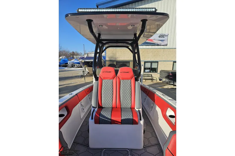 Slide: The Image of 2025 Concept 27' CC boat interior with red and gray seating, modern design. - 107