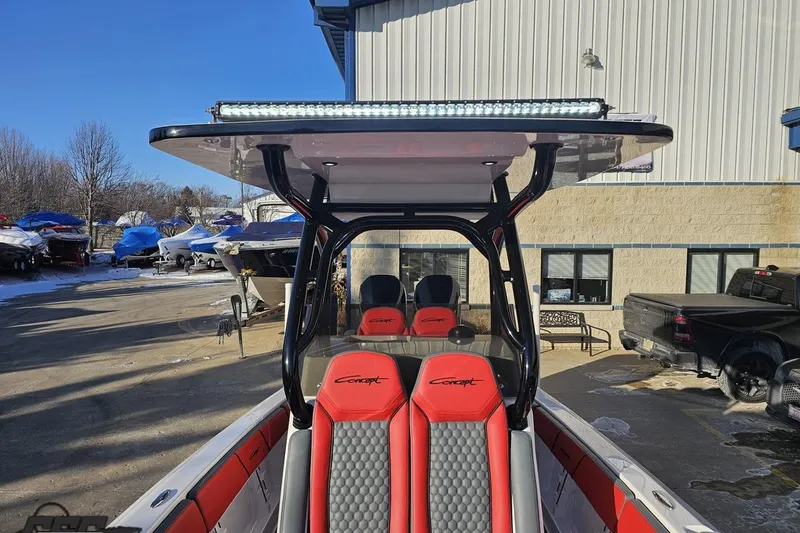 Slide: The Image of 2025 Concept 27' CC boat with red seats and T-top in a marina setting. - 108