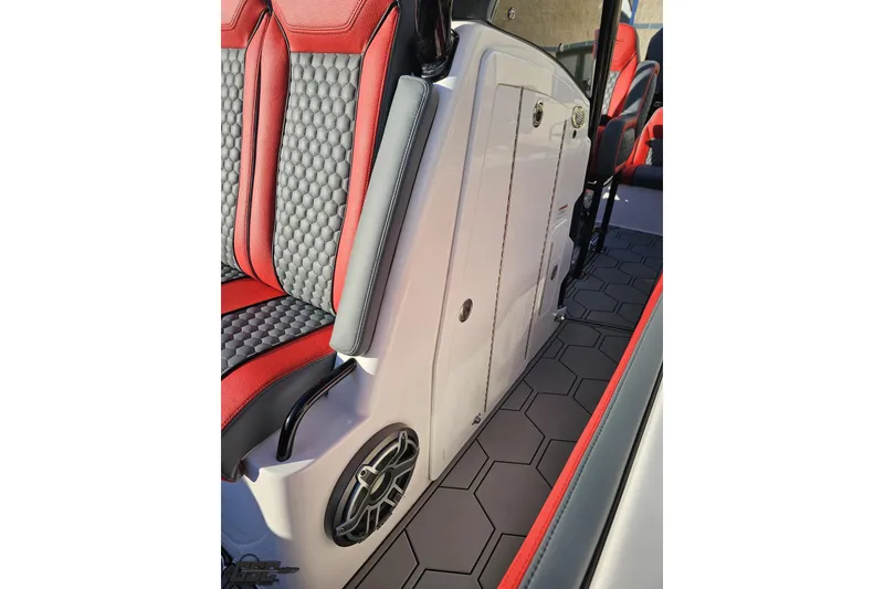 Slide: The Image of 2025 Concept 27' CC boat interior with red and black seating, hexagonal flooring, and speaker. - 112