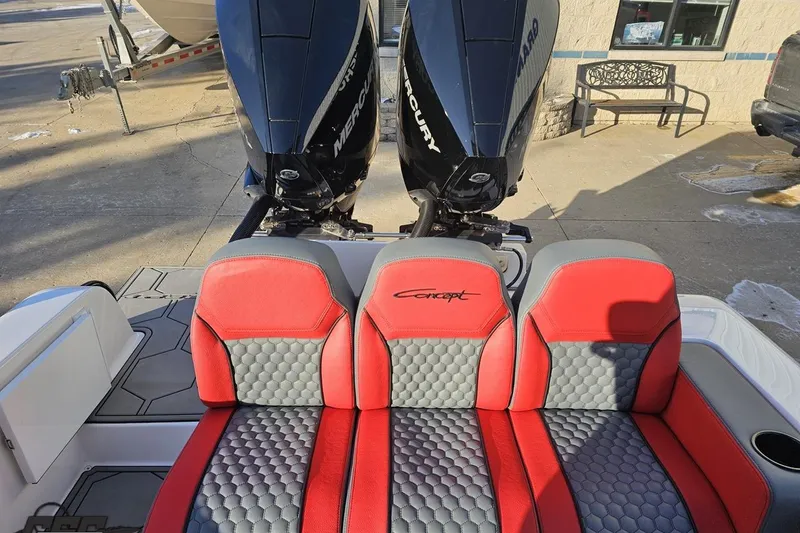 Slide: The Image of 2025 Concept 27' CC boat with red and gray seating, dual Mercury engines. - 120