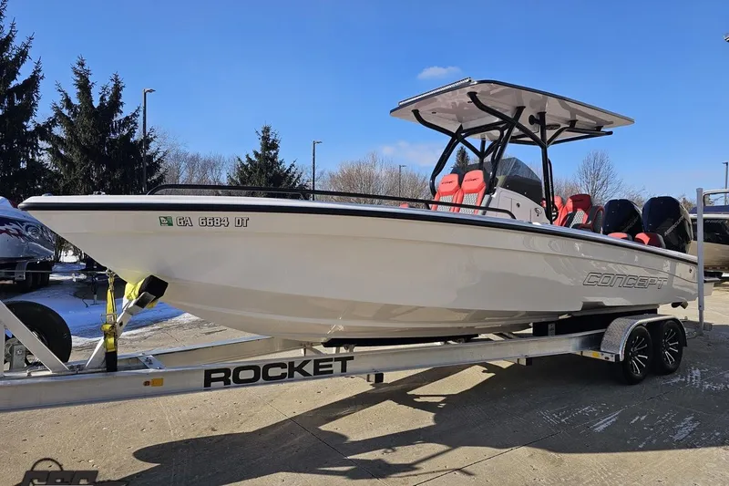 Slide: The Image of 2025 Concept 27' CC boat on trailer, featuring sleek design and modern seating. - 16