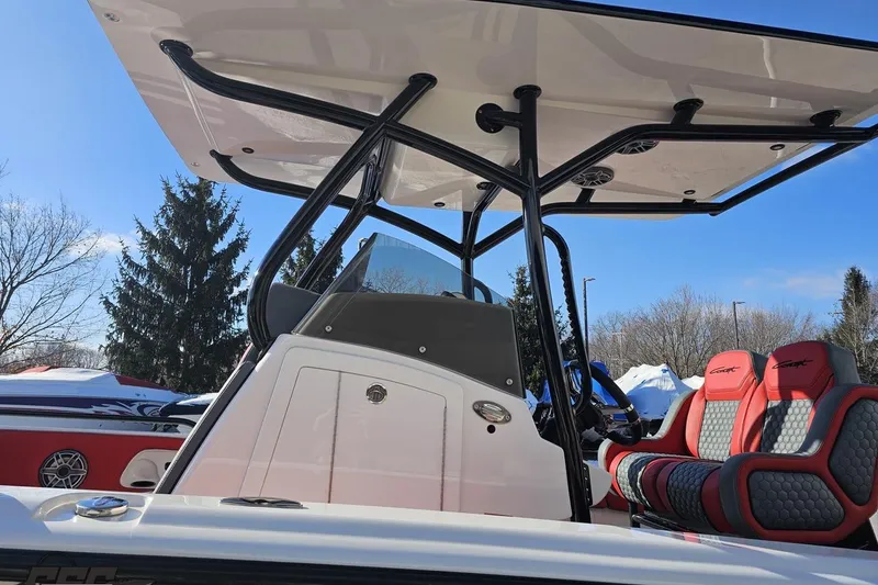 Slide: The Image of 2025 Concept 27' CC boat with sleek design and modern seating under a clear blue sky. - 20