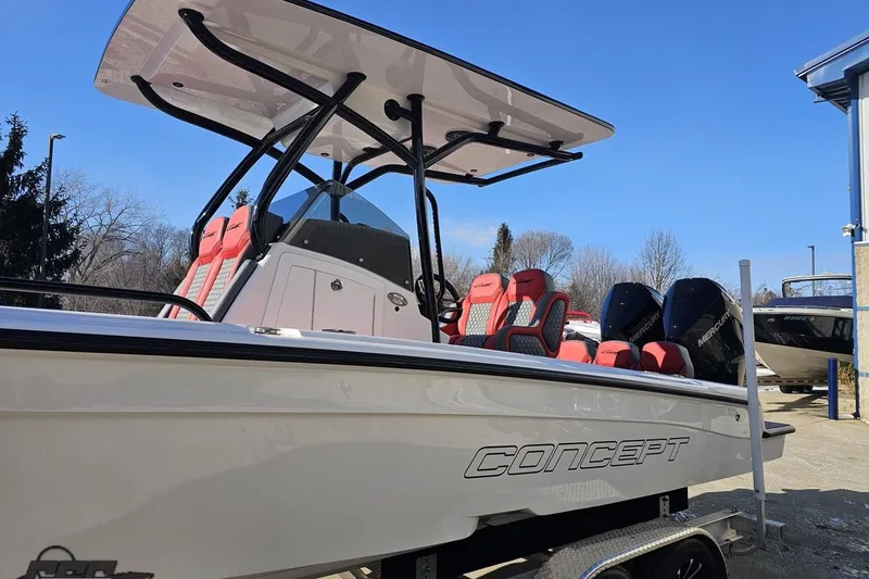 Slide: The Image of 2025 Concept 27' CC boat with red seating and dual Mercury engines. - 21