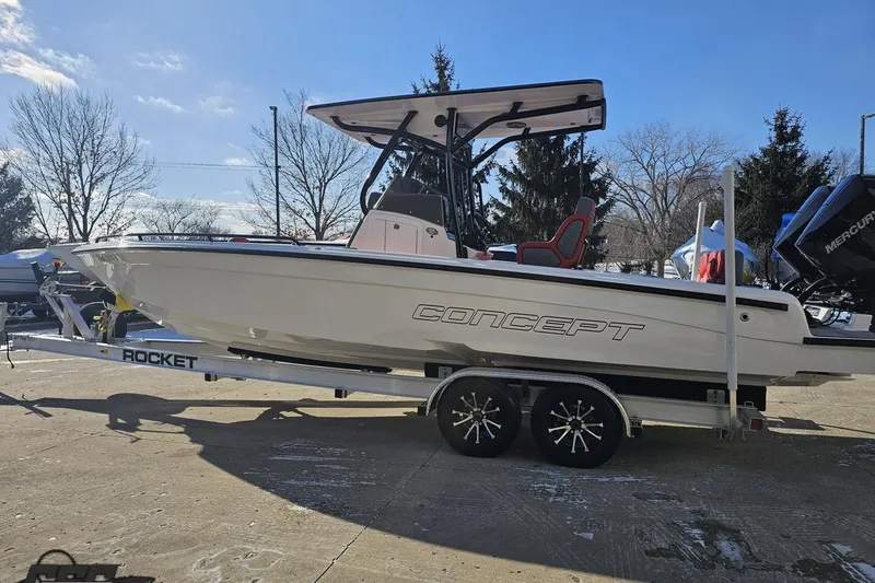 Slide: The Image of 2025 Concept 27' CC boat on trailer, sunny day, outdoor display. - 25