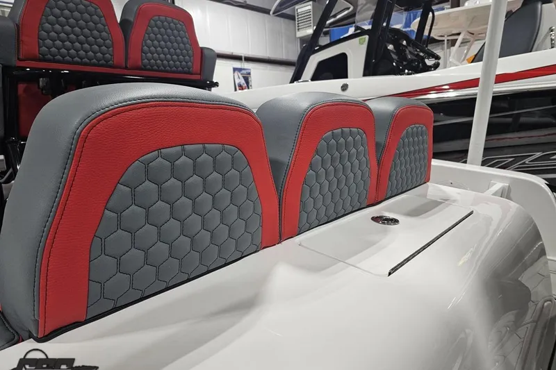 Slide: The Image of Red and gray hexagonal-patterned seats on 2025 Concept 27' CC boat. - 32
