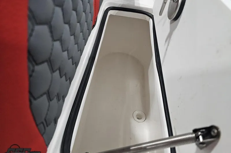 Slide: The Image of 2025 Concept 27' CC boat storage compartment with red and gray cushioned seating. - 33