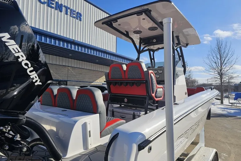 Slide: The Image of 2025 Concept 27' CC boat with Mercury engine, showcased outdoors in a snowy setting. - 42