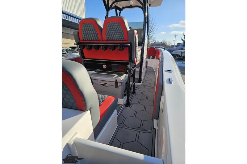 Slide: The Image of 2025 Concept 27' CC boat interior with red and gray seating, modern design. - 50
