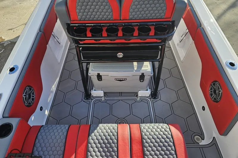 Slide: The Image of Interior of 2025 Concept 27' CC boat with red and gray seating, hexagonal flooring. - 54