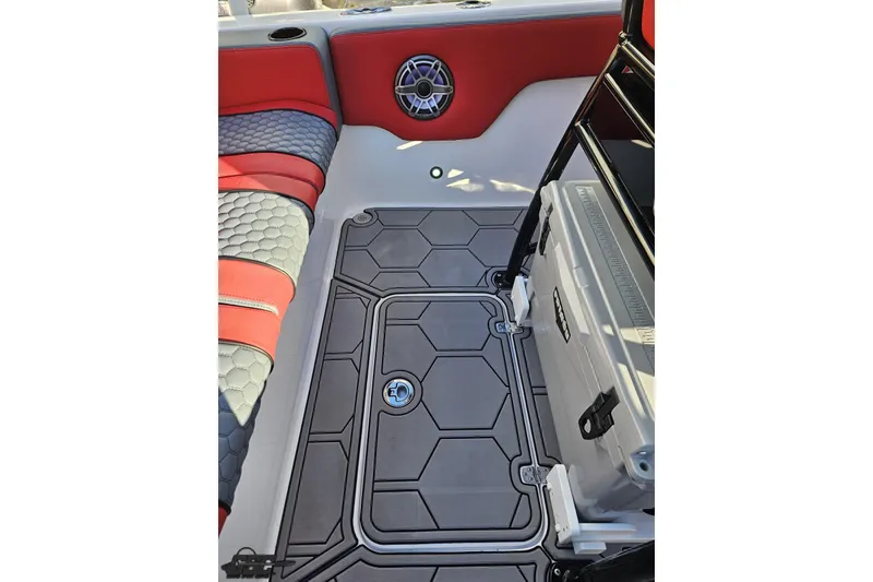 Slide: The Image of 2025 Concept 27' CC boat interior with red and gray seating, hexagonal flooring, and cooler. - 60
