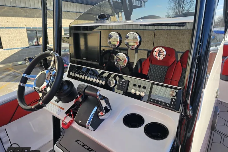 Slide: The Image of 2025 Concept 27' CC boat dashboard with modern controls and steering wheel. - 68