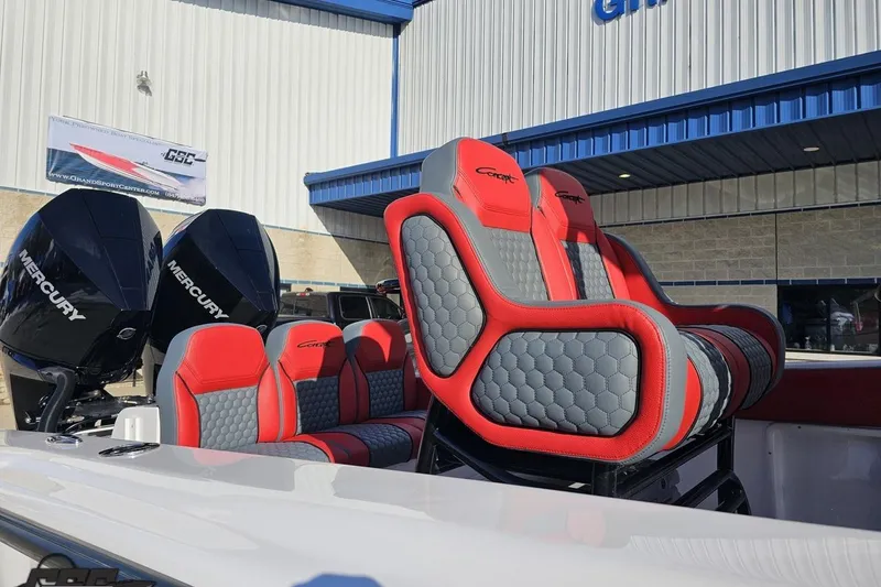 Slide: The Image of Red and gray seating on 2025 Concept 27' CC boat with Mercury engines. - 7
