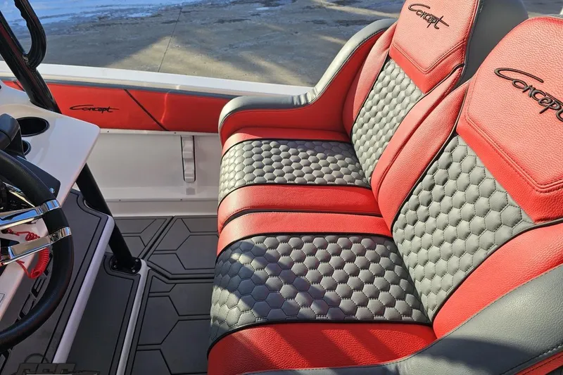 Slide: The Image of Red and black interior seating of 2025 Concept 27' CC boat, featuring hexagonal patterns. - 71