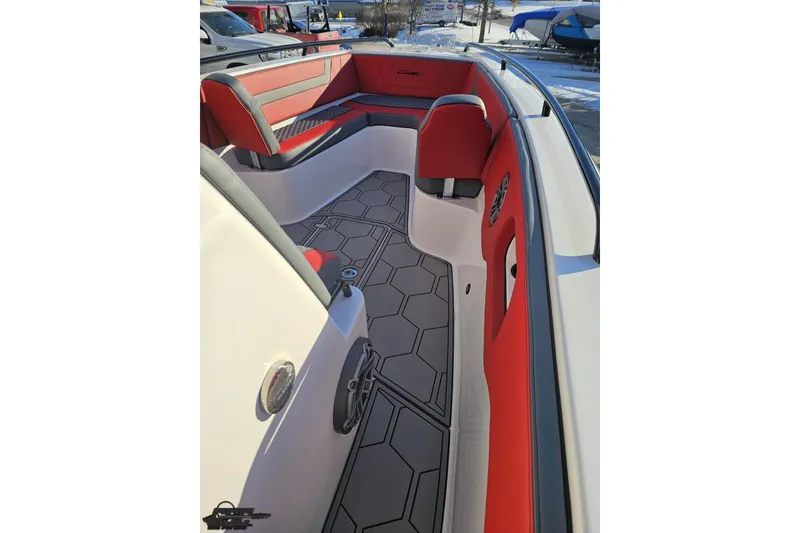 Slide: The Image of 2025 Concept 27' CC boat interior with red and gray seating, hexagonal floor design. - 83