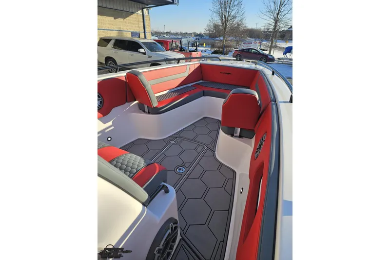 Slide: The Image of 2025 Concept 27' CC boat interior with red and gray seating, hexagonal flooring design. - 84
