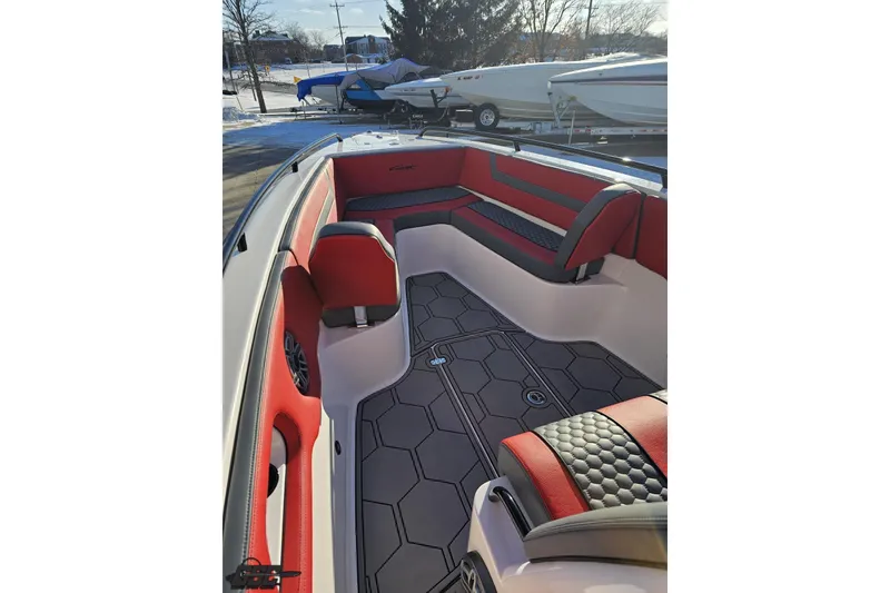 Slide: The Image of 2025 Concept 27' CC boat interior with red and black seating, hexagonal floor design. - 91