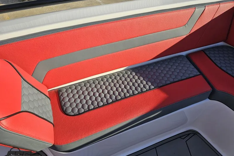 Slide: The Image of Red and gray seating in 2025 Concept 27' CC boat, featuring hexagonal pattern design. - 96