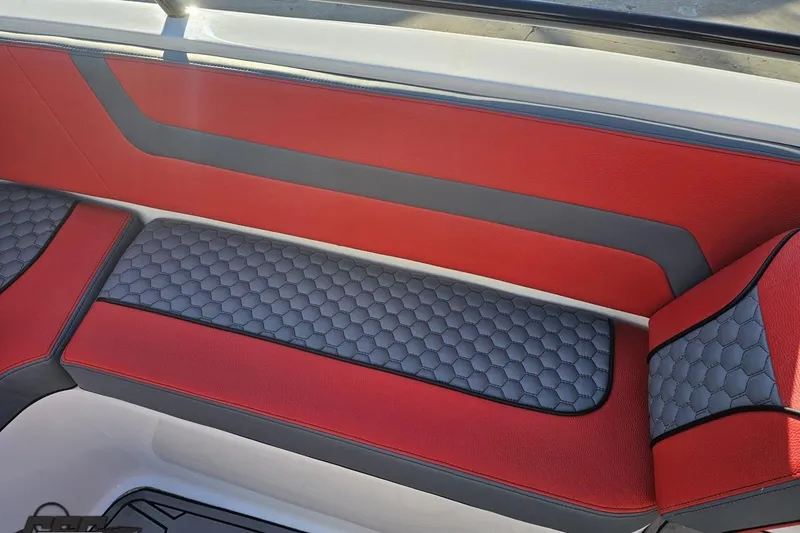 Slide: The Image of Red and gray seating in 2025 Concept 27' CC boat, featuring hexagonal pattern design. - 98