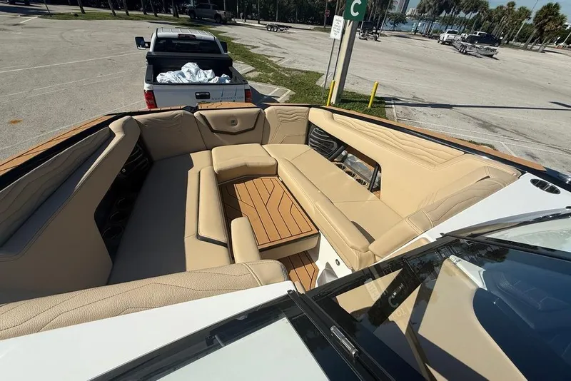 Slide: The Image of 2026 Nautique Super Air Nautique G25 Coastal Edition with luxurious seating and wooden accents. - 7