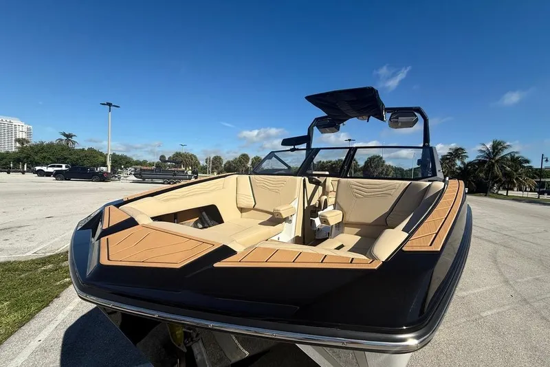 Slide: The Image of 2026 Nautique Super Air Nautique G25 Coastal Edition boat with luxurious seating and sleek design. - 9