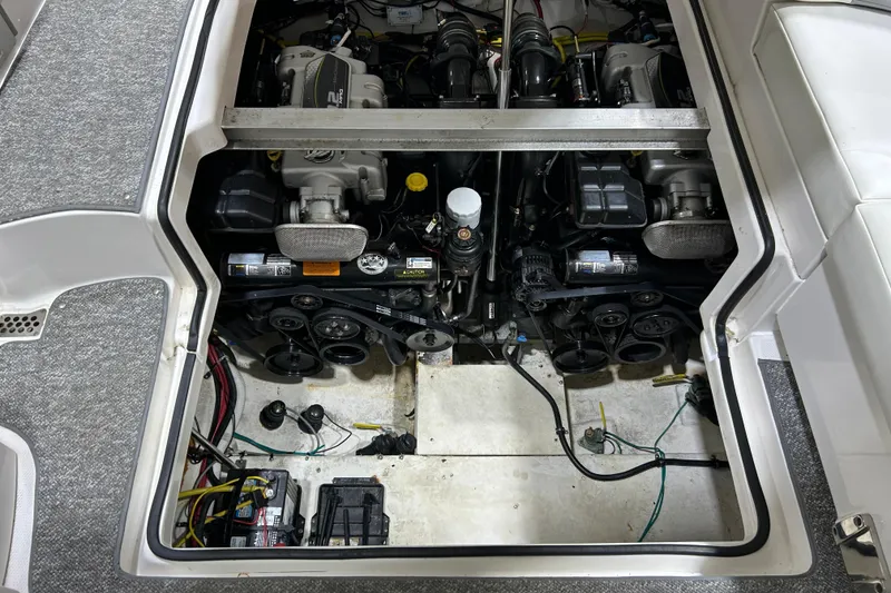 Slide: The Image of Engine compartment of a 2012 Chaparral 327 SSX boat, showcasing dual engines and components. - 101