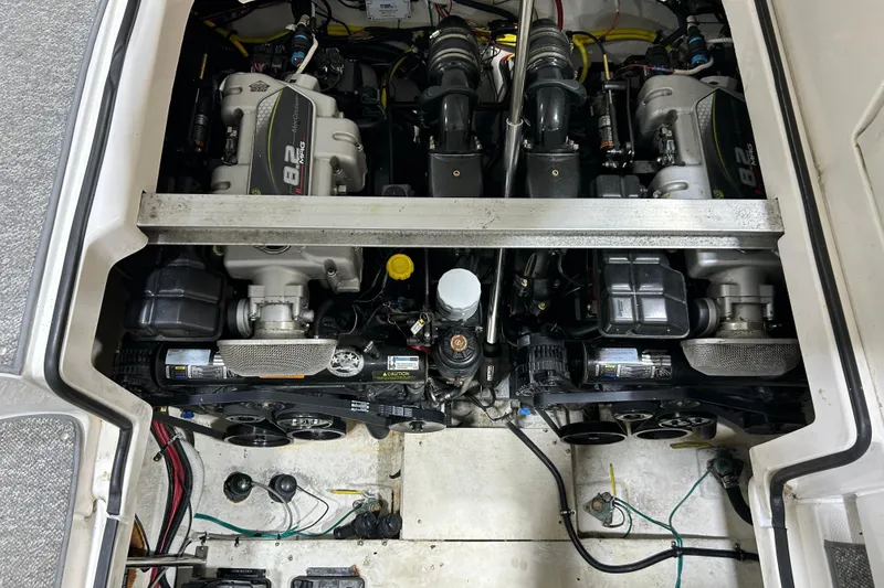 Slide: The Image of Engine compartment of a 2012 Chaparral 327 SSX boat, showcasing dual 8.2L engines. - 102
