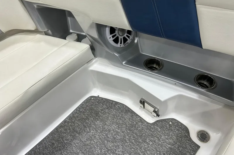 Slide: The Image of Interior of 2012 Chaparral 327 SSX boat with seating, speaker, and cup holders. - 108
