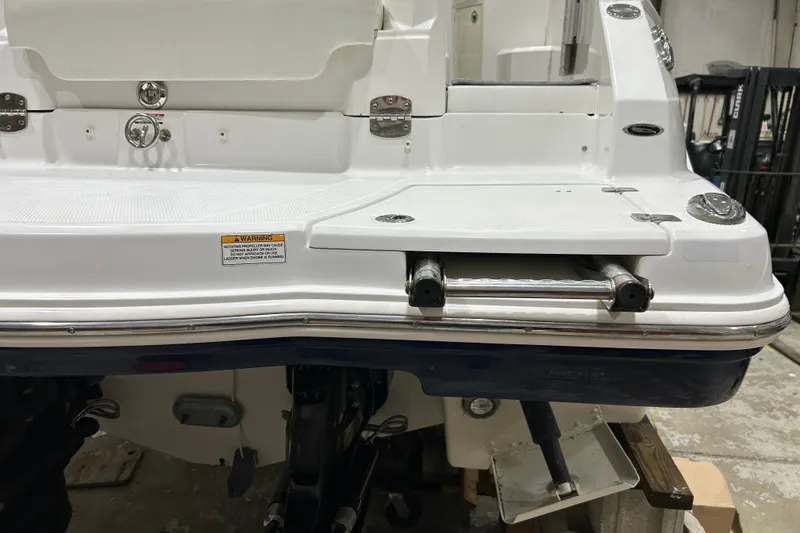 Slide: The Image of 2012 Chaparral 327 SSX boat stern with swim platform and retractable ladder. - 16