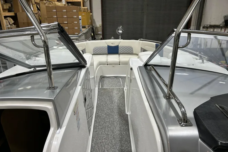 Slide: The Image of 2012 Chaparral 327 SSX boat interior with seating and stainless steel railings. - 21